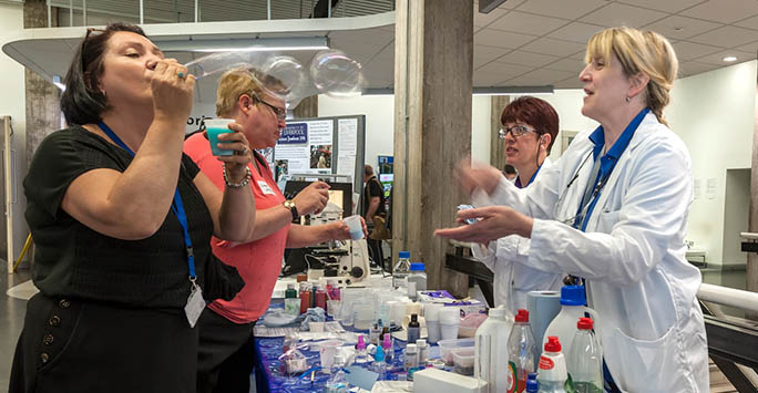 A delegate blowing bubbles during an event held in the Central Teaching Hub.