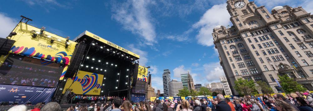 crowd of people in front of a stage