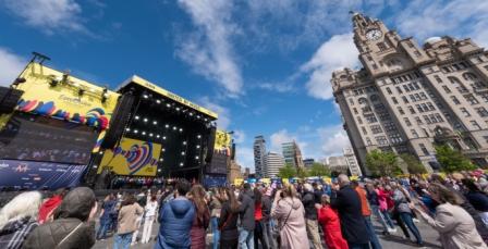 a large crowd looking towards performance stage