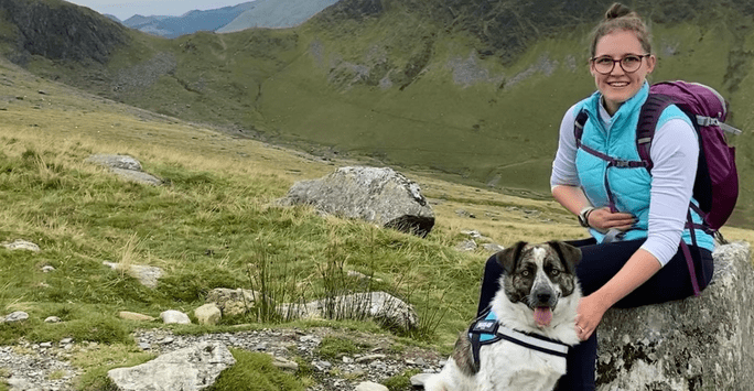 Kaylea and her dog Cosmo on a mountain hike