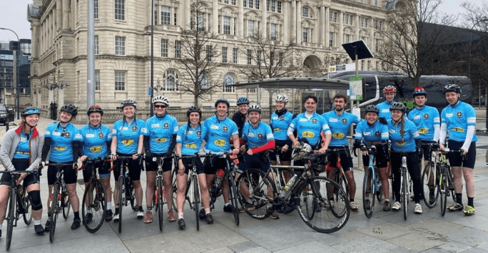 LMSS members posing with their bikes and with their bike helmets on