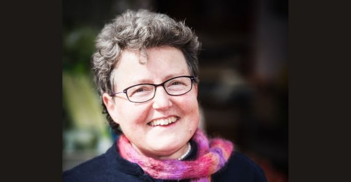 Headshot of Professor Catherine Rowett - she is smiling into the camera