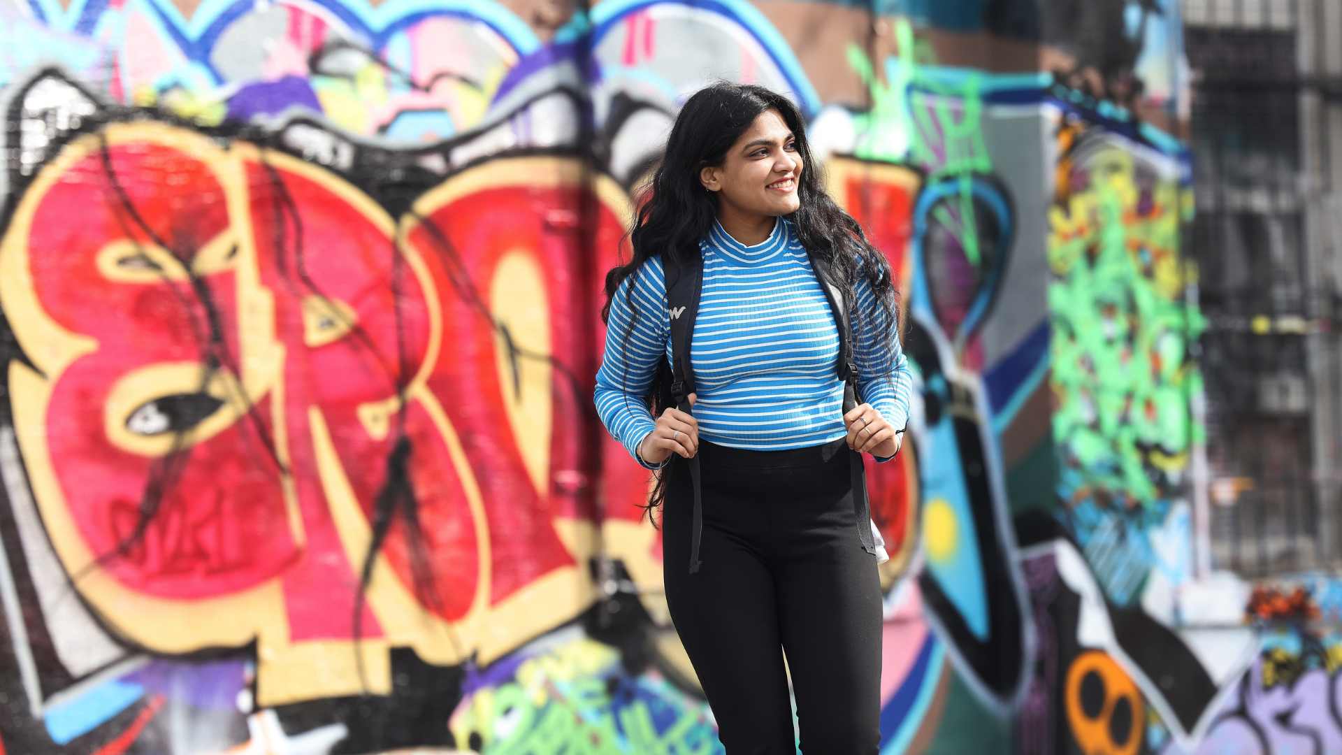 A Student in front of graffiti - urban