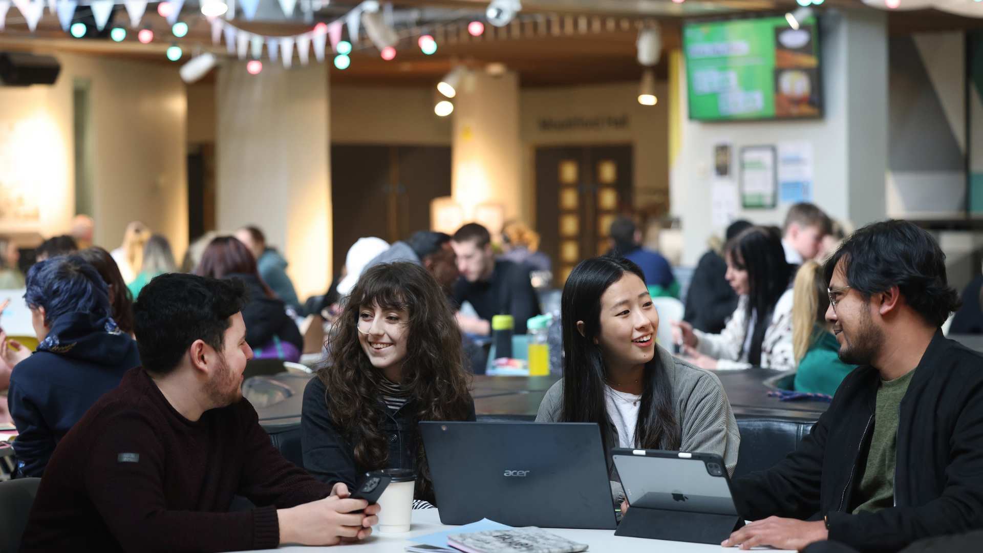 Students sitting on a table talking