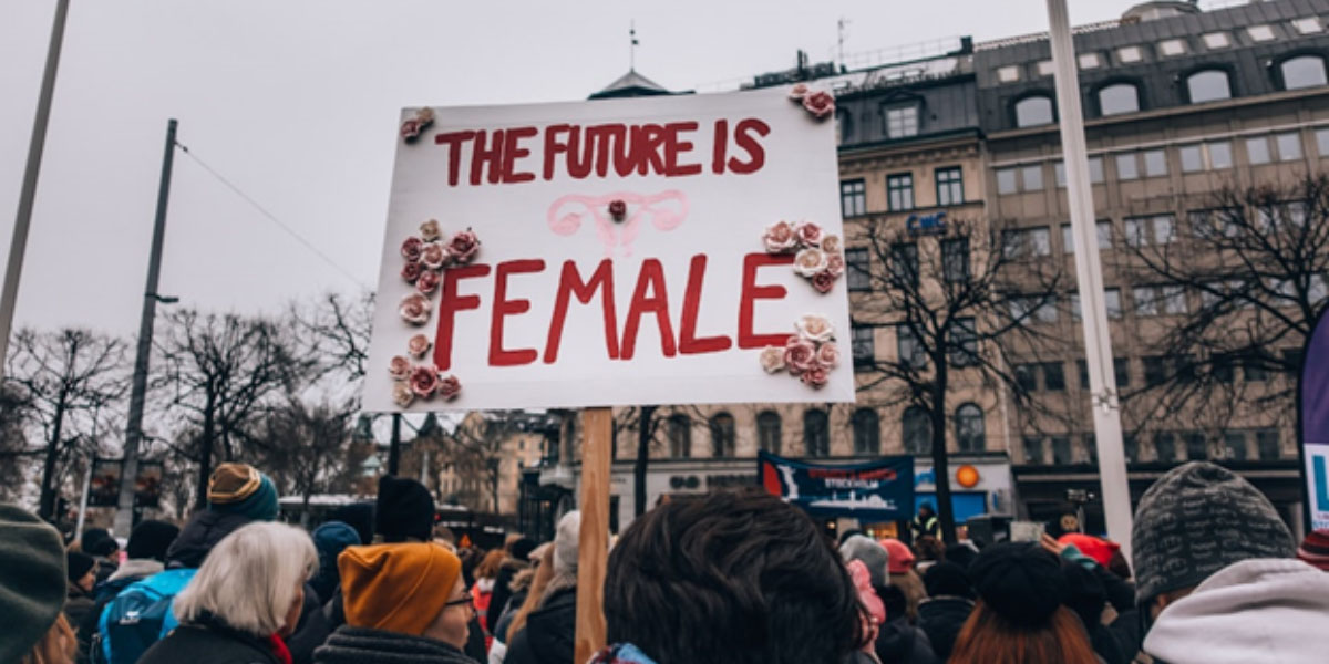 An image showcasing a banner that reads 'the future is female'