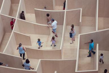 People walking through a maze