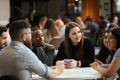 A group of students around a table