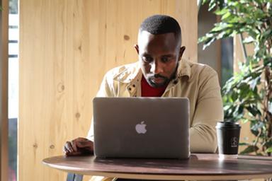 A student working at a laptop