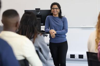 A student standing at the front of the class