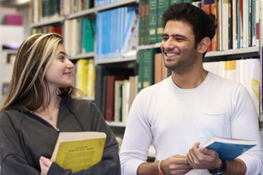 Two students smiling