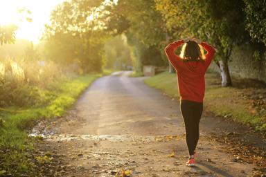 A woman walking in the sunshine