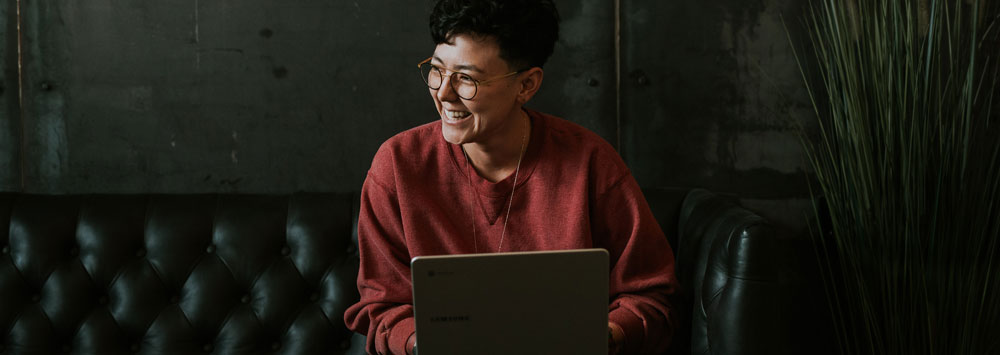 a man sat with laptop. unsplash