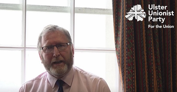 uup doug beattie sitting in front of a window