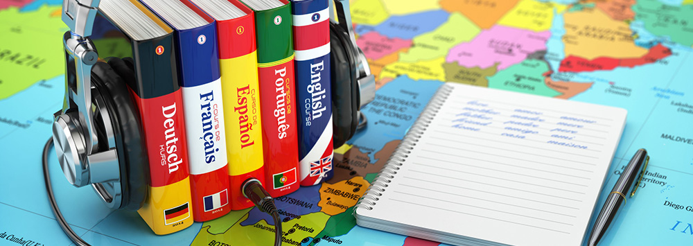 Headphones plugged into a set of language books