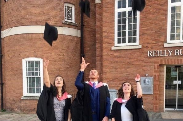 Rebecca throwing her cap on graduation.