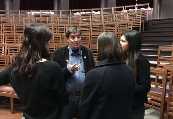 Man talking to students