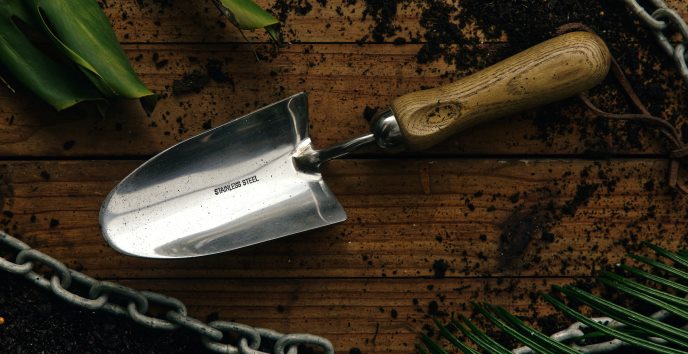 Hand trowel on a wooden bench