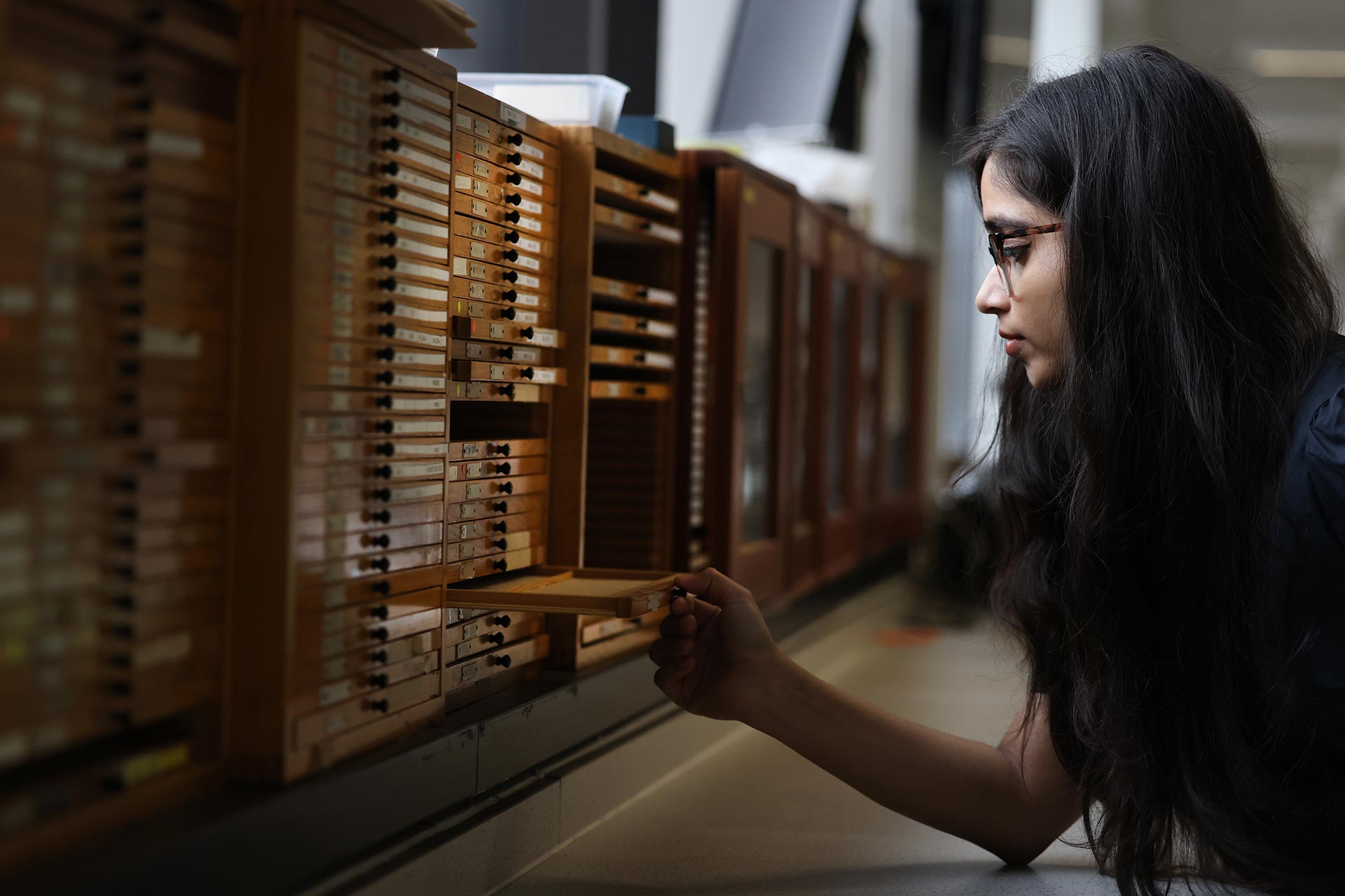 Pramita Pandit in the library - Postgraduate Student