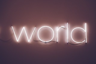 A picture of the word 'world' written in neon lights