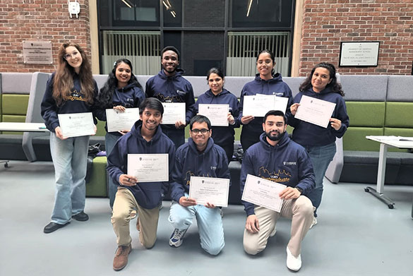 ULMS ExECS Class of 2024 pose with their awards