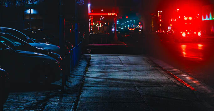 Neon lit street at night time.