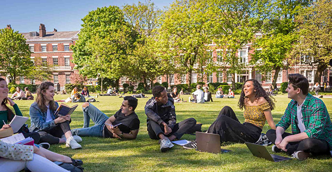 Students sit out on Abercromby Square Gardens 