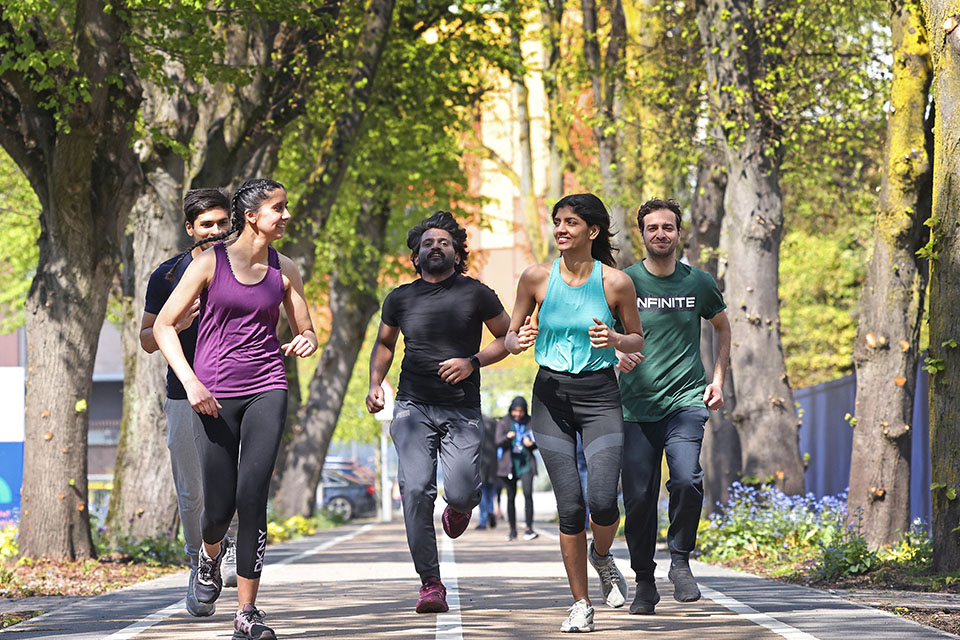 People running on the sprint track on campus