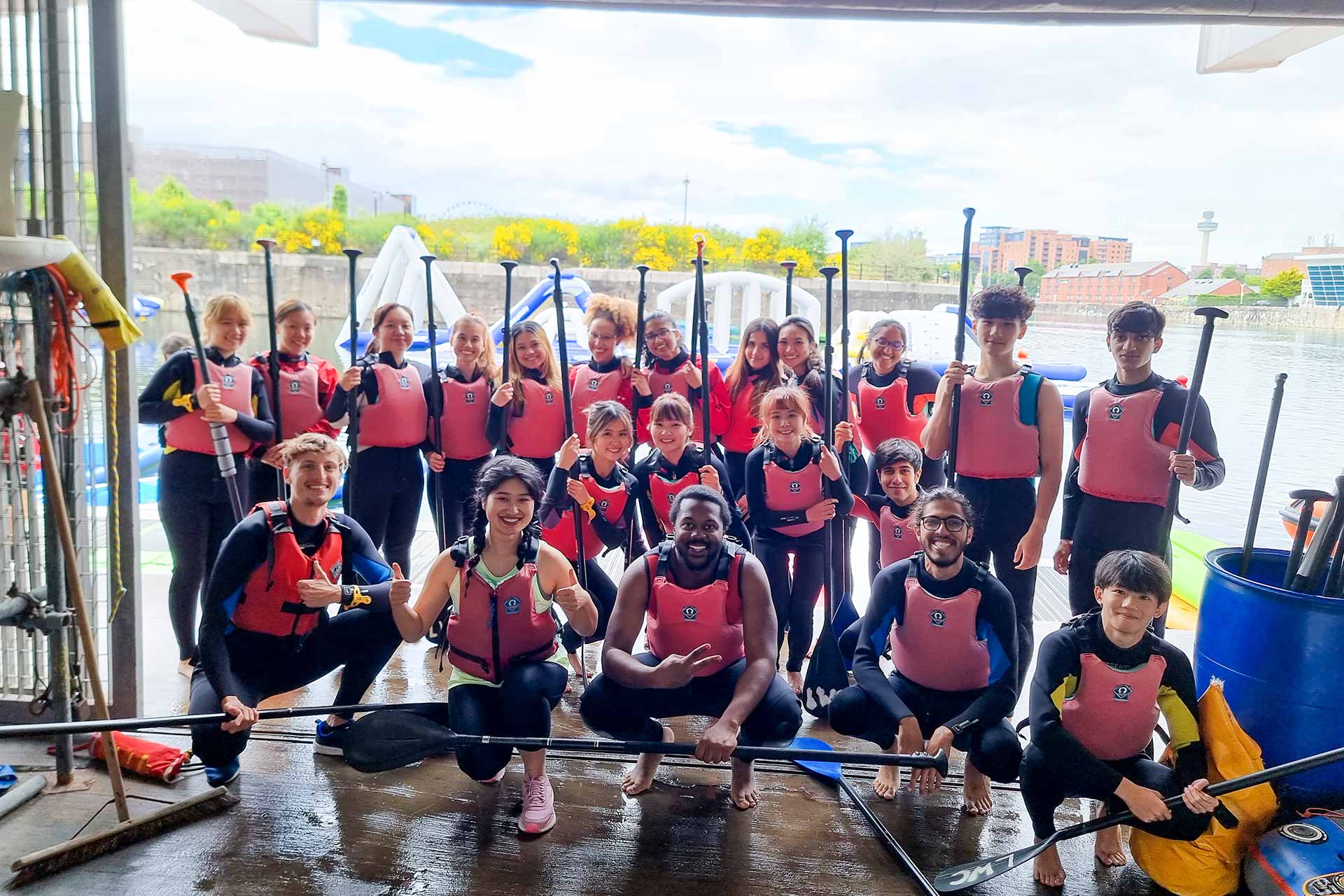 A group of International summer School students playing watersports together